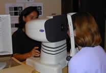 Technician Brenda Houtenbrink measures a patient's optical errors using the Bausch & Lomb Zywave.